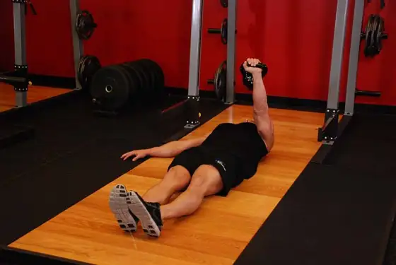 One-Arm Kettlebell Floor Press — end position