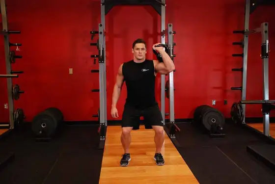 One-Arm Kettlebell Push Press — end position