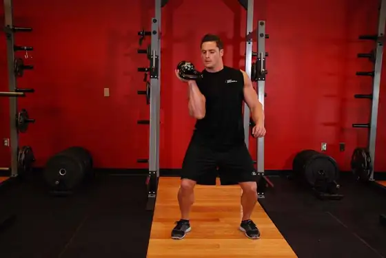 One-Arm Open Palm Kettlebell Clean — end position