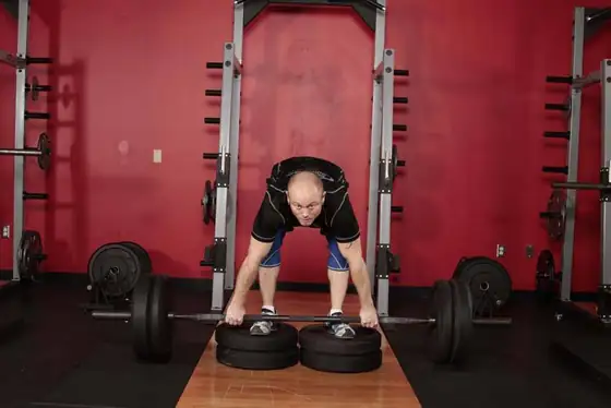 Romanian Deadlift from Deficit — end position