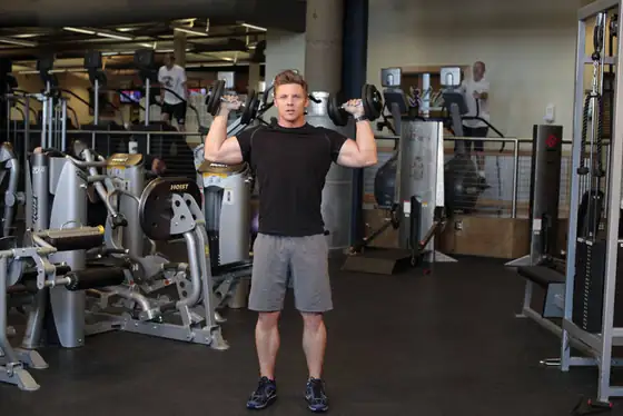 Standing Alternating Dumbbell Press — start position