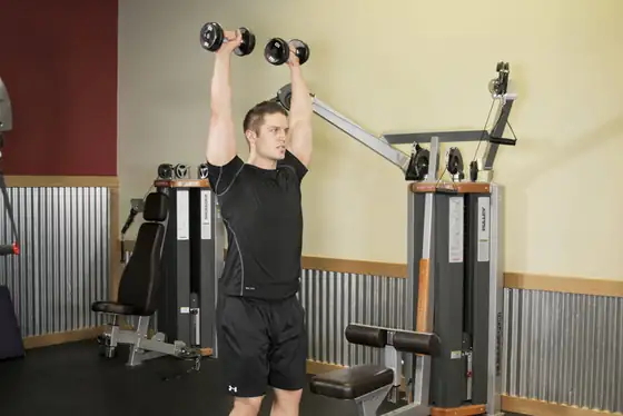 Standing Dumbbell Press — end position