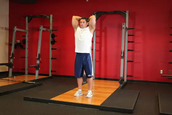 Standing Dumbbell Triceps Extension — end position