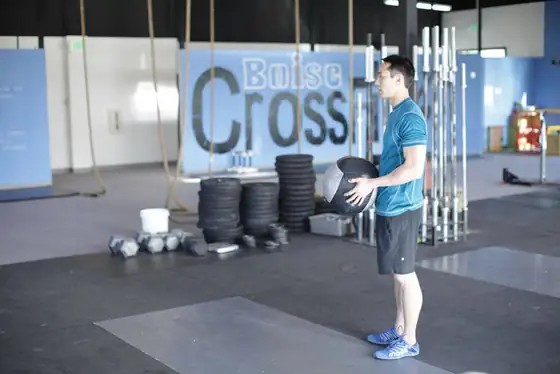 Standing Two-Arm Overhead Throw — start position